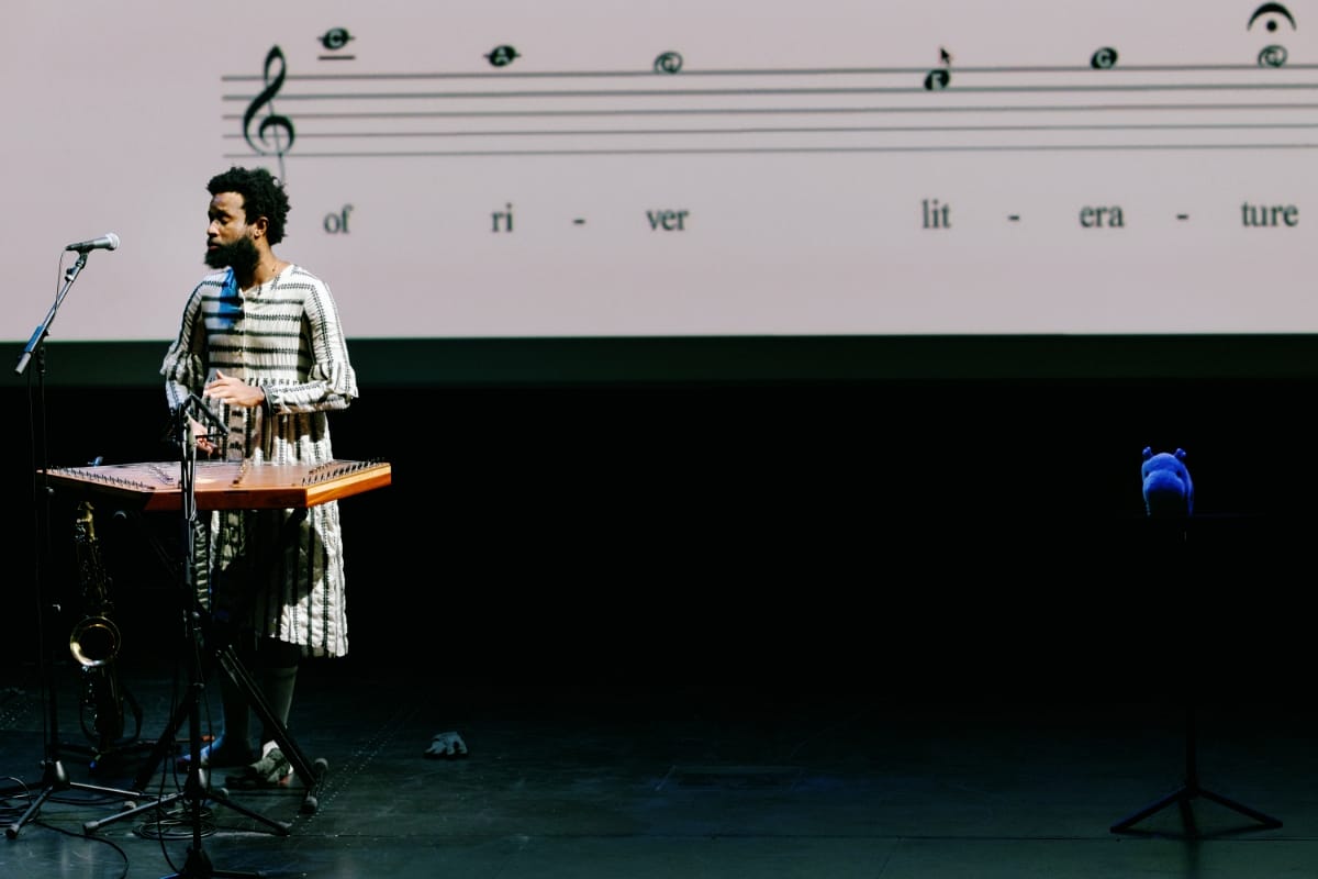 JJJJJerome Ellis performing in front of projected sheet music - Photo by Bailey Holiver