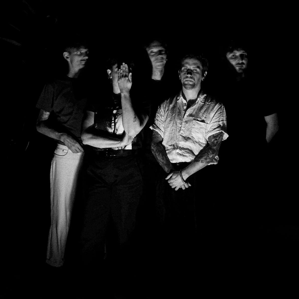 Pain Magazine standing in the dark - Photo by Mae Ferron