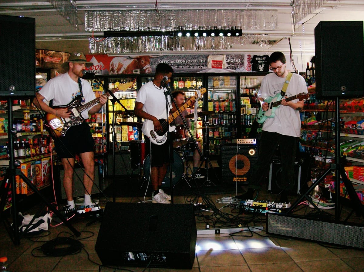 Tiberius playing live at the Friendly Rio Market in Austin. Photo by Sam Schlesinger.