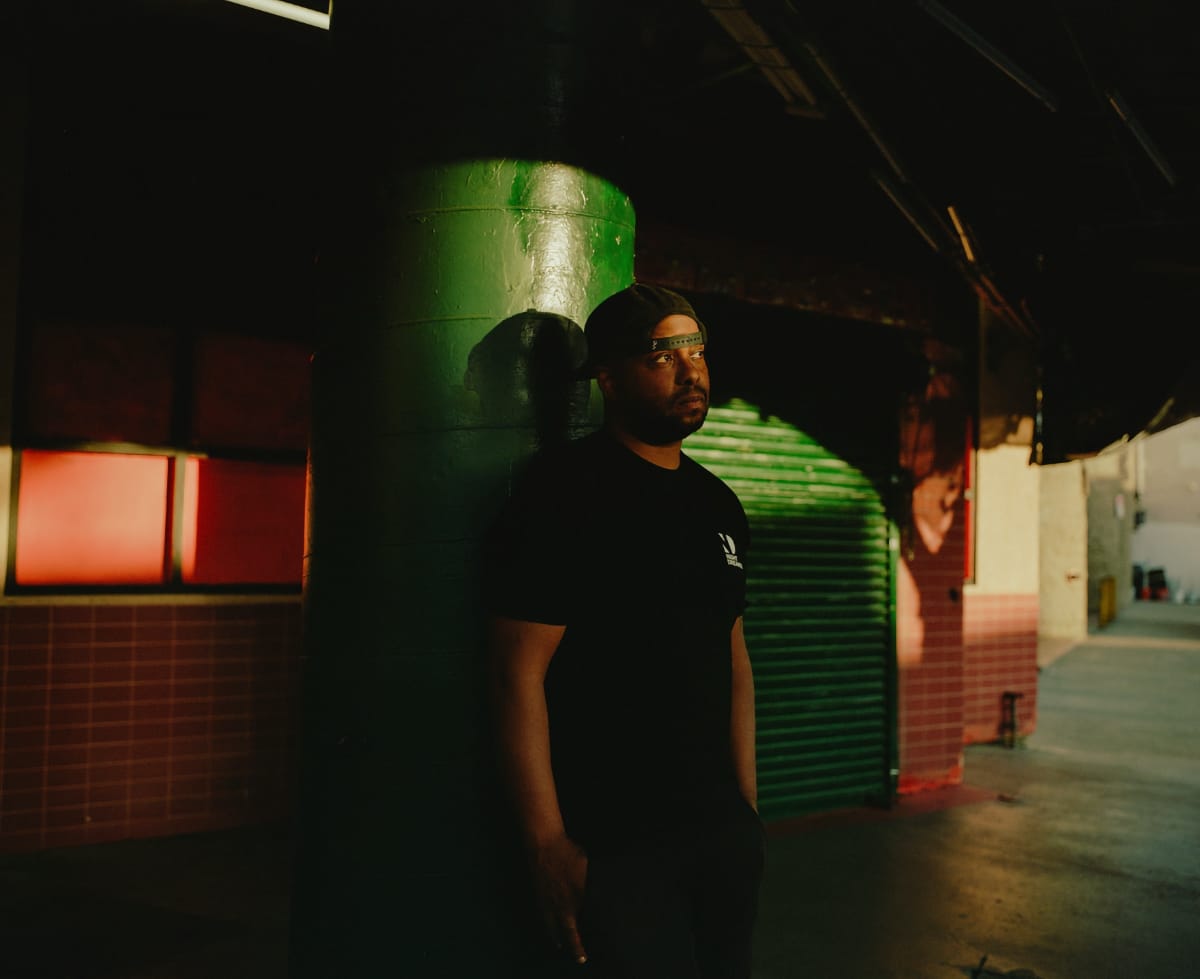 Ben Marc standing in front of a closed music venue - Photo by Harley Astorga