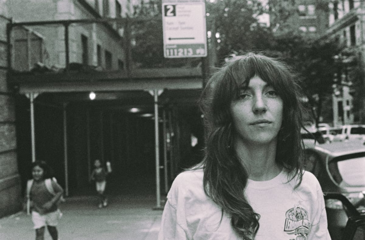 Prewn walking down a city street - Photo by Harry Wohl