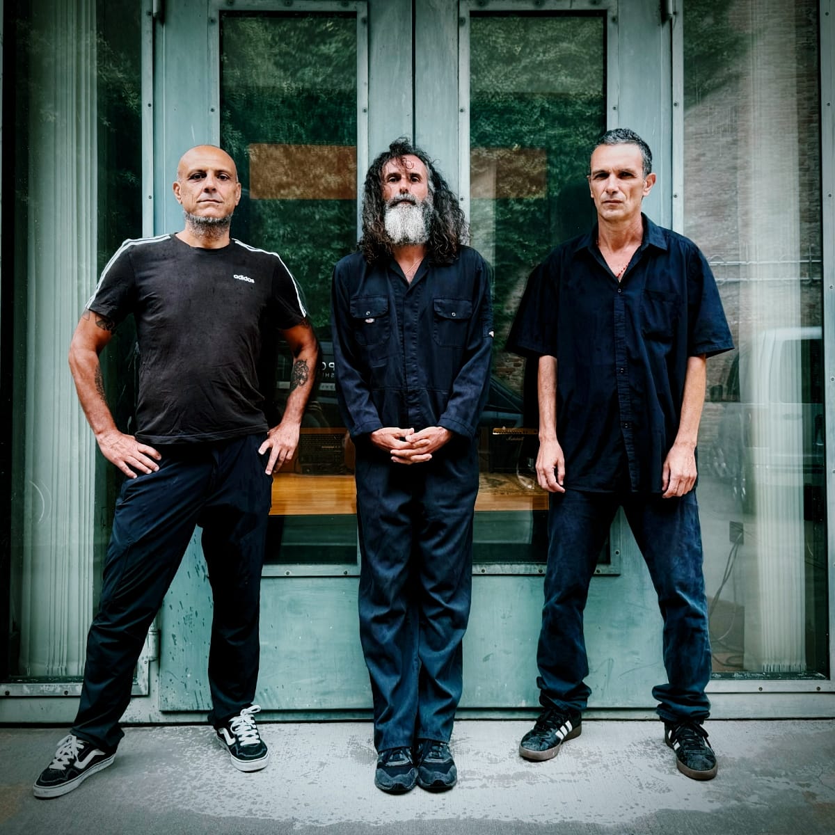 The three members of Zu standing around. Photo by Marco Franzoni.