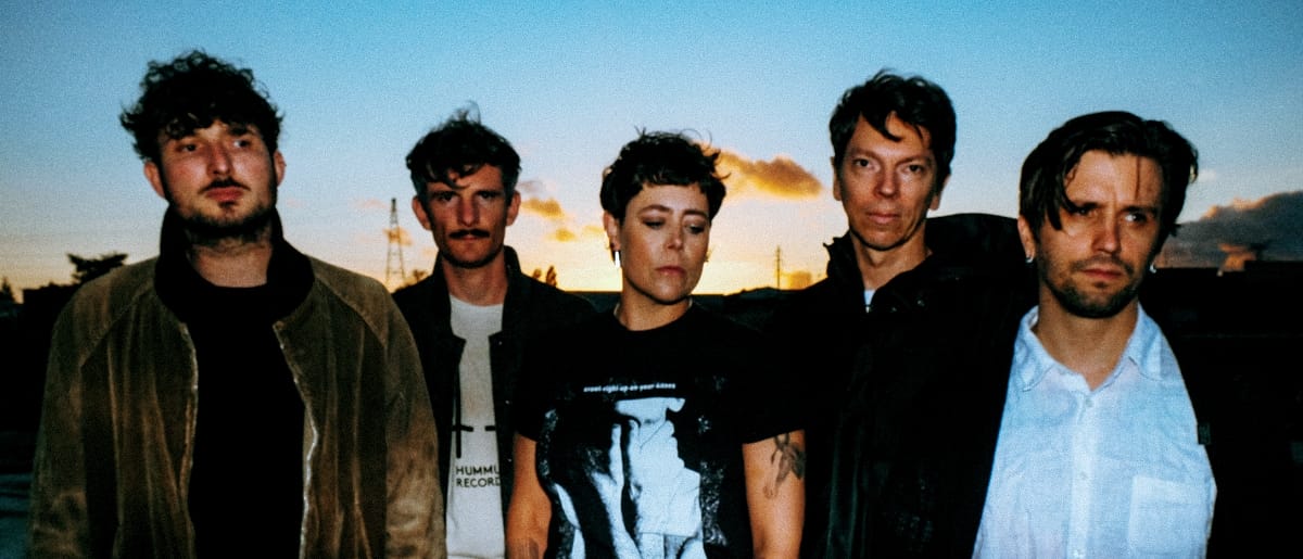 The five members of Pain Magazine standing as the magic hour happens on the horizon - Photo by Mae Ferron