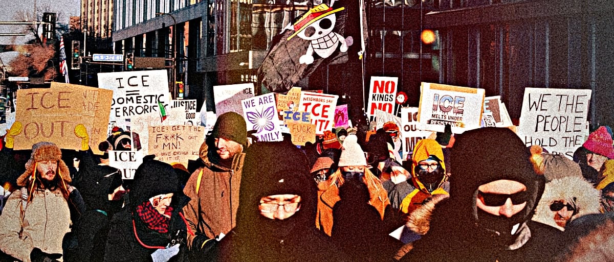 Winter protest march in Minneapolis with demonstrators in heavy coats holding anti-ICE signs amid urban buildings. Photo by Fibonacci Blue, courtesy of Wikimedia Commons.