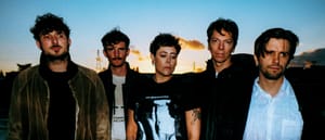 The five members of Pain Magazine standing as the magic hour happens on the horizon - Photo by Mae Ferron