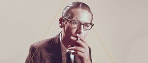 Bill Evans in the early '60s, smoking a cigarette.
