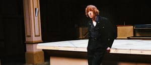 Daniel Avery stands against the bar in an empty nightclub. Photo by Kalpesh Lathigra.