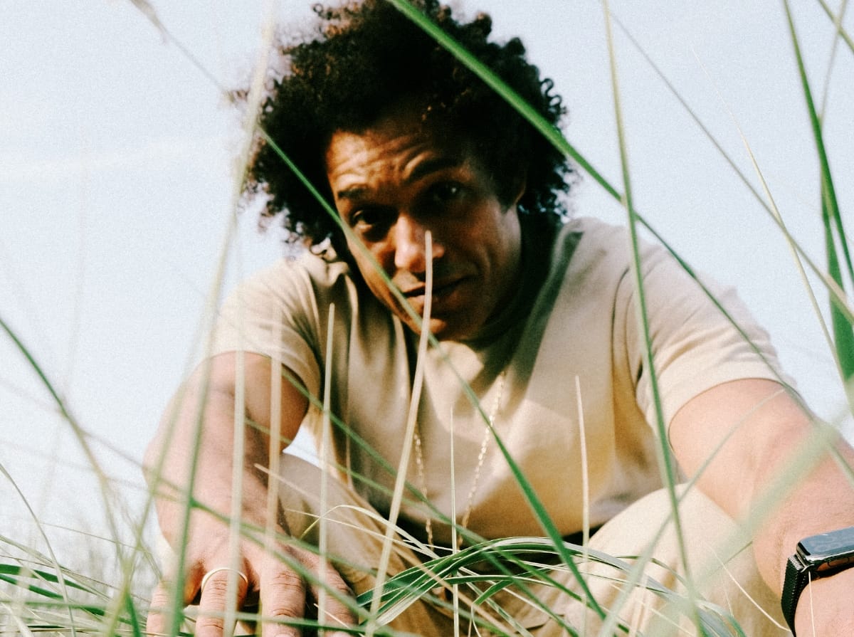 Makaya McCraven in the grass - Photo by Shannon Marks